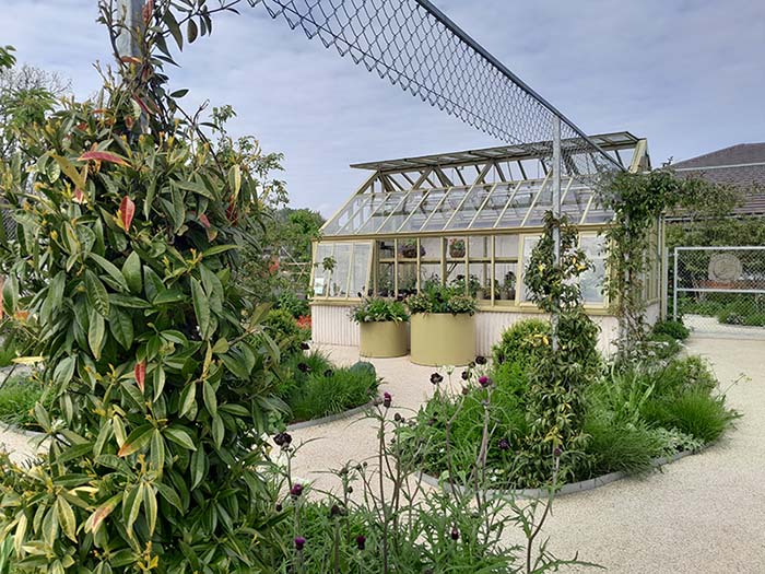 Horatio's Garden wild flowerbeds surrounding a greenhouse