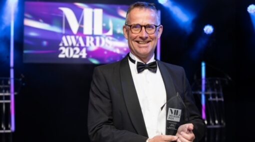 Hugh Potter at the Manchester Legal Awards 2024 holding his Lifetime Achievement Award