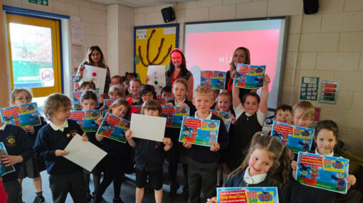 Children from the primary school show of their Brake Beep Beep! day road safety certificates