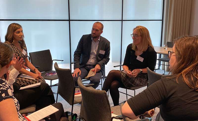 Attendees of the the NatWest "Powering up your future" event held at the Hugh James 2 Central Square headquarters speak with Hugh James Partners who also attended the event