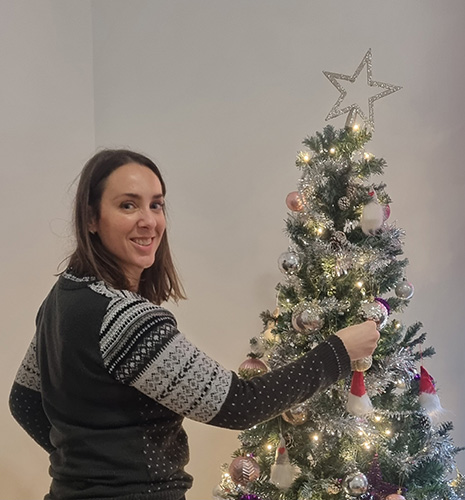 Louise Gardner decorating a tree for Decorate for December at Ronald McDonald House Bristol